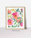 Bright abstract floral print of pink, coral and yellow blooms in a wooden frame