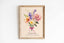 Birth flower family print: watercolour bouquet tied with a pink ribbon, with The Williams Family and names below
