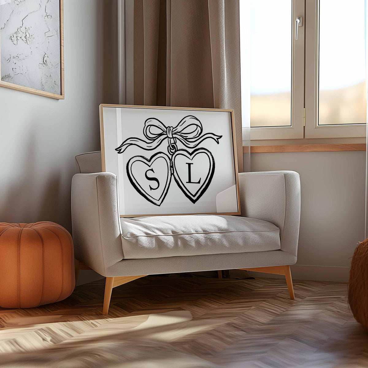 Personalized initials locket print for couples, framed on a cream armchair by a sunny window