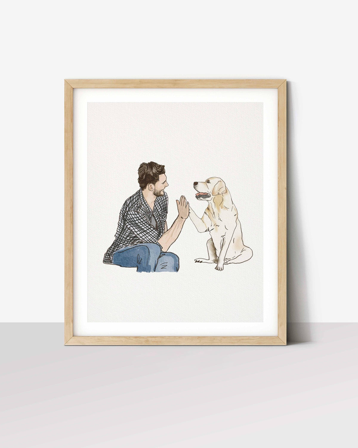 Framed watercolour portrait of a man high-fiving his golden retriever, a family portrait with a dog