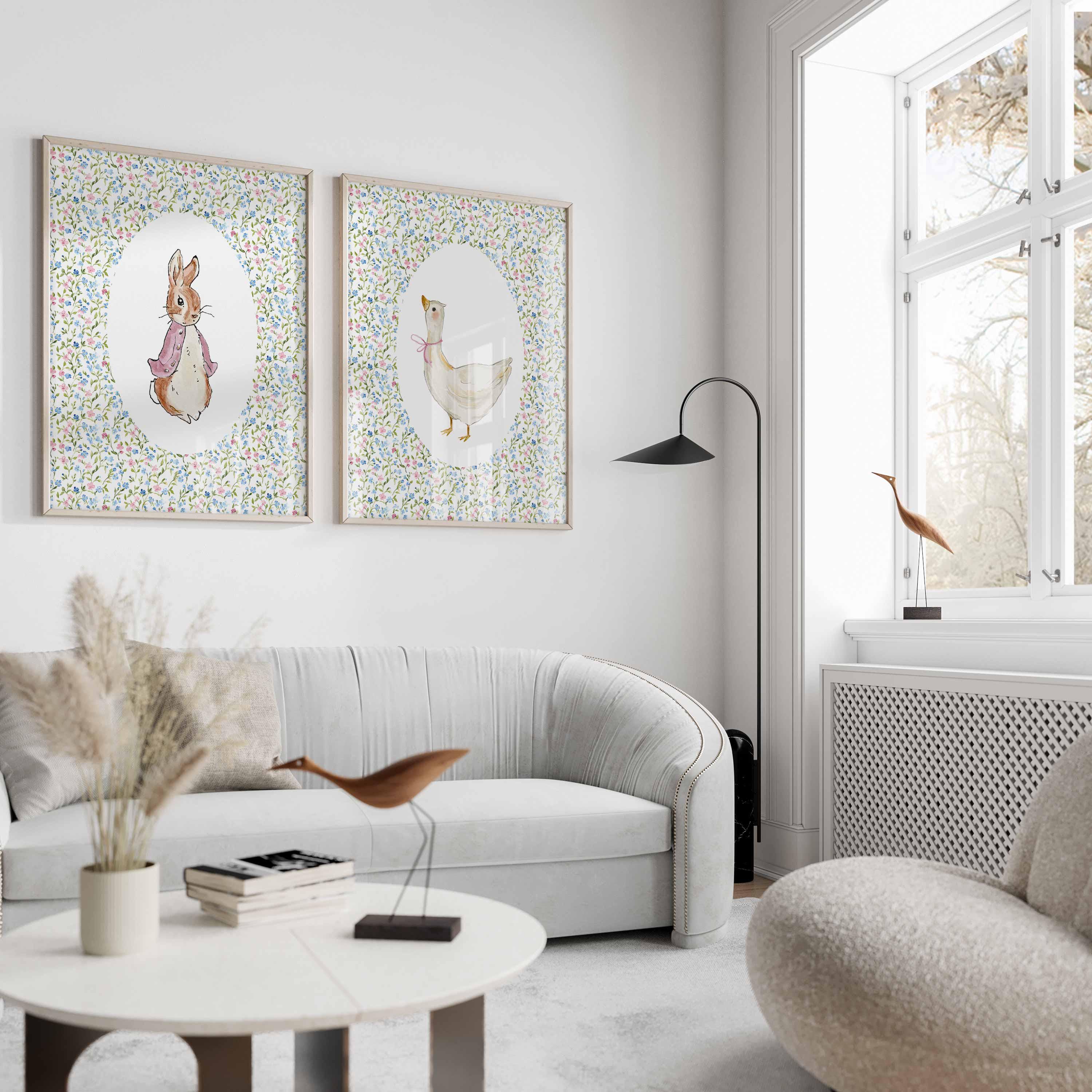Peter Rabbit style bunny and goose pair above a curved white sofa