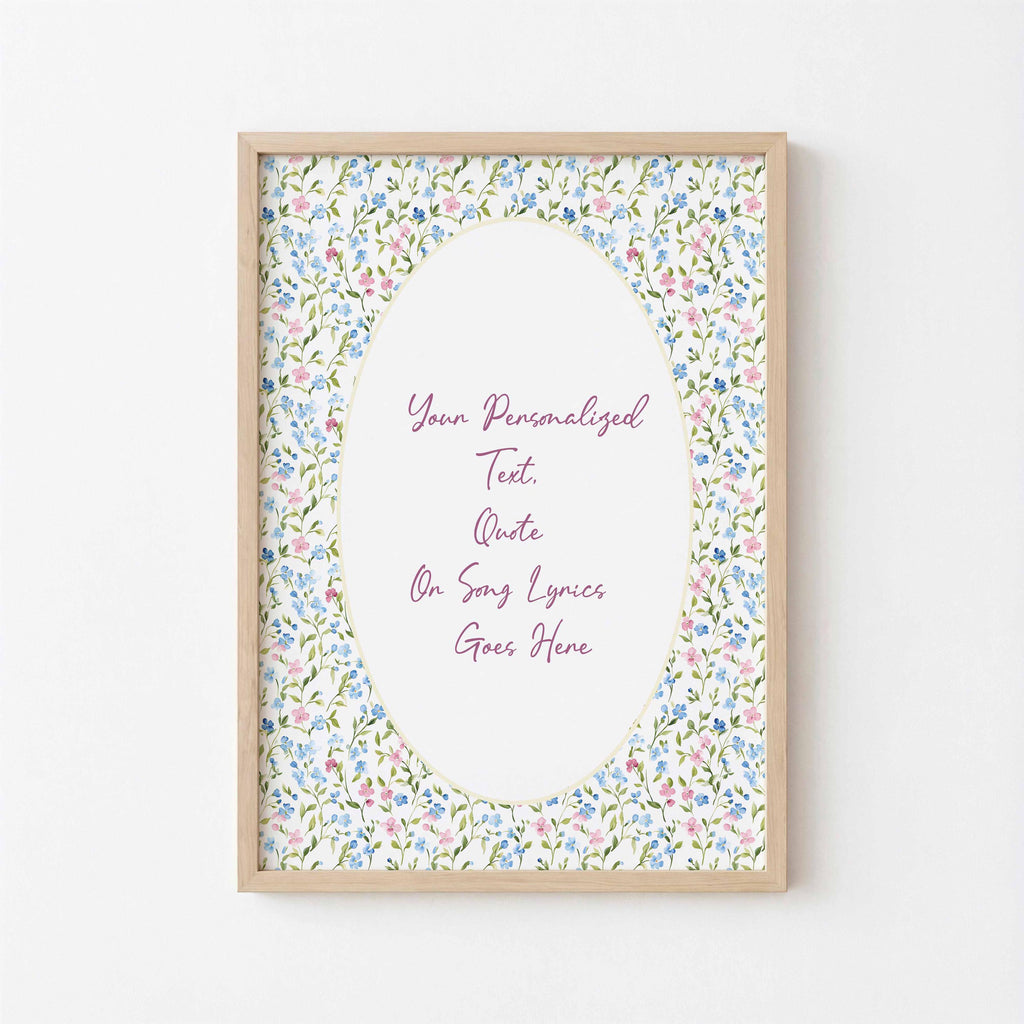Floral custom lyric print: script text in an oval framed by pink and blue watercolour wildflowers