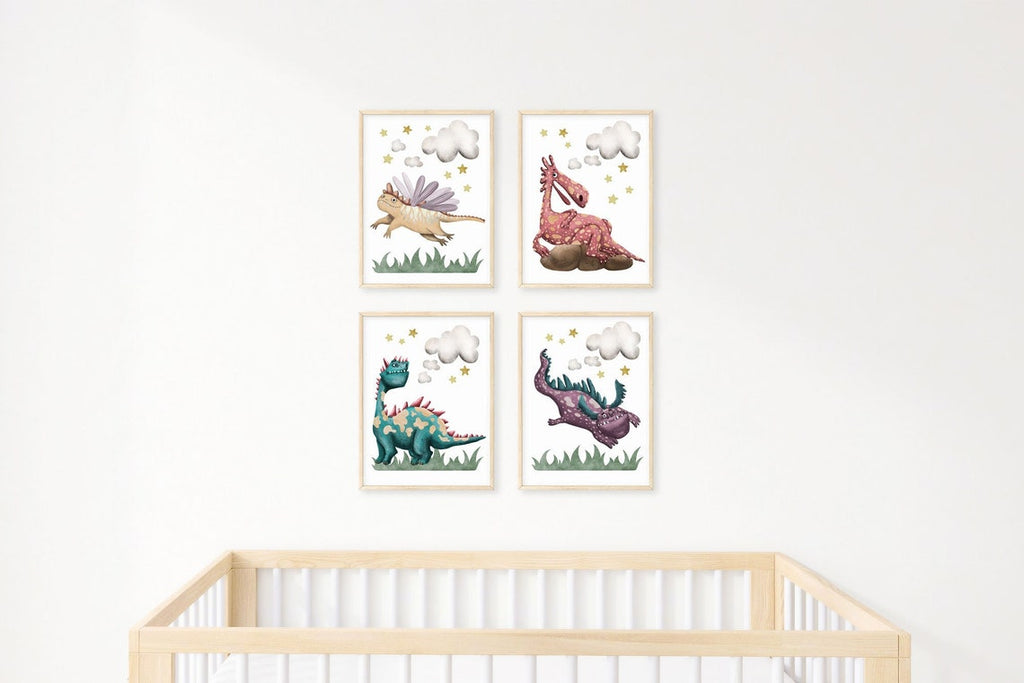 Four pastel dragon prints as a grid above a light wood crib